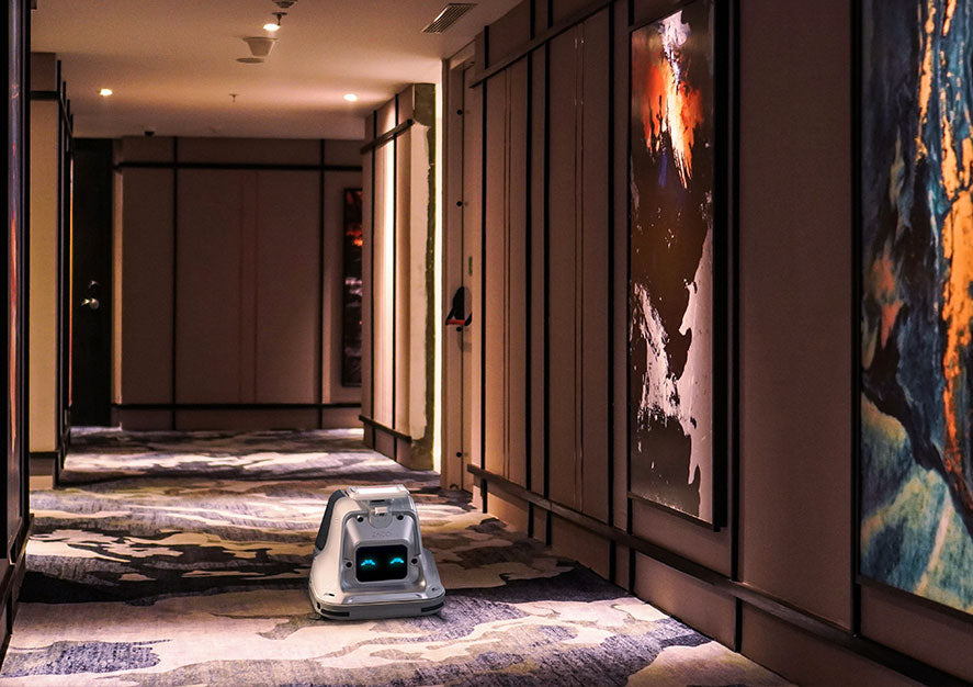 robot cleaning hotel corridor